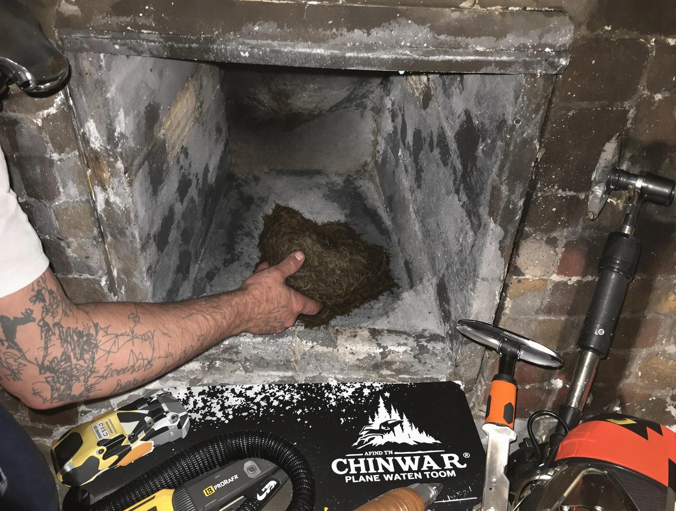 Lawrence Chimney Sweep safely removing debris and screening chimney in Lawrence, MA