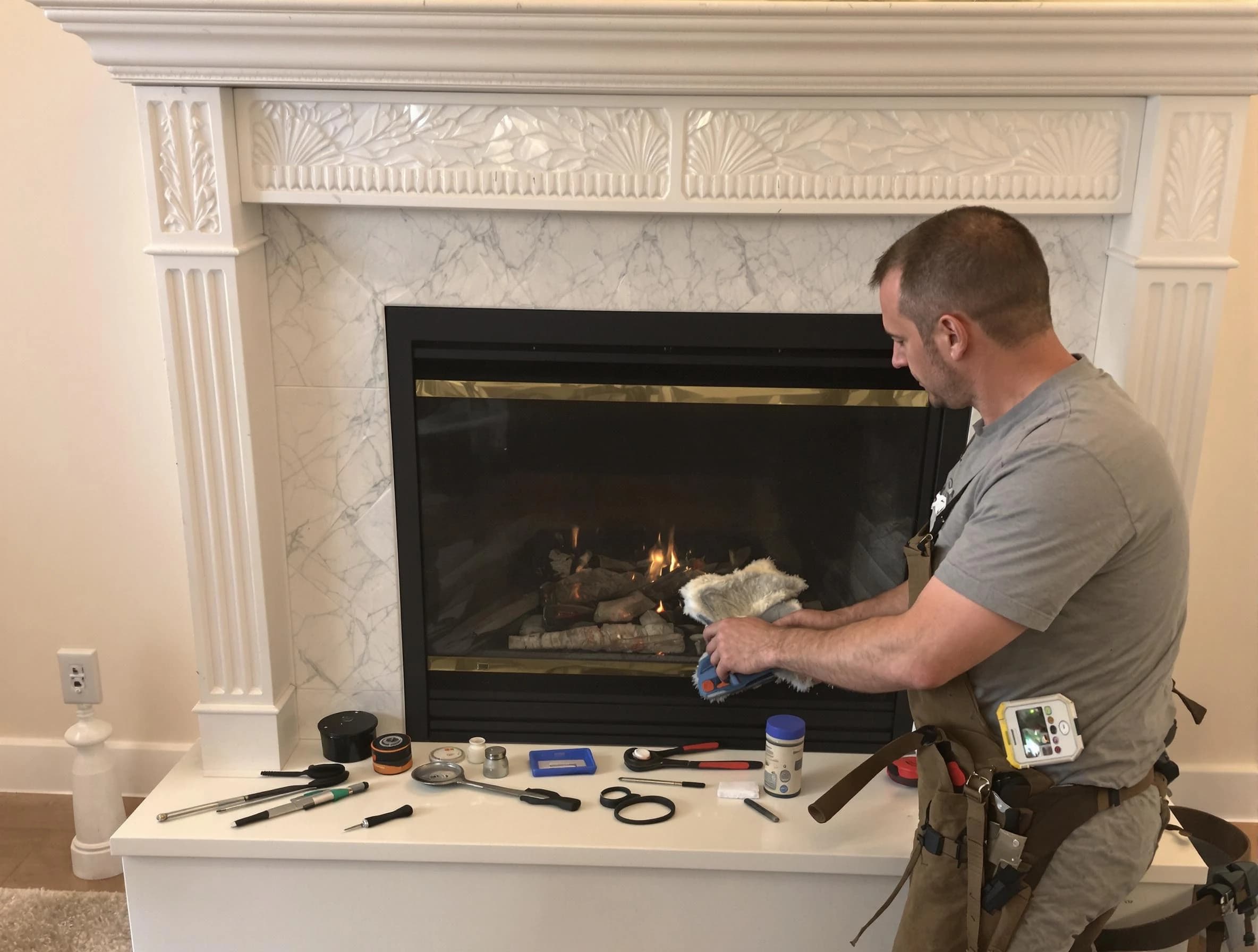Lawrence Chimney Sweep performing fireplace maintenance in Lawrence, MA